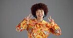 Portrait, peace sign or woman in studio, retro fashion or vintage style on gray background. Happy person, face or model with hand gesture, v symbol or emoji with clothing outfit, icon or mockup space