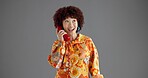 Fashion, happy and woman with telephone in studio with trendy clothes, style and outfit. Vintage, retro aesthetic and person with phone call for communication, contact and gossip on gray background