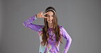 Portrait, peace sign or woman in studio, vintage fashion or clothing style on gray background. Happy person, icon or model with gesture, v symbol or emoji with retro outfit, smile or mockup space