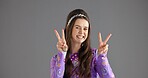 Portrait, peace sign or woman with smile, retro fashion or clothes style on gray studio background. Person, face or model with hand gesture, v symbol or emoji with vintage outfit or mockup space