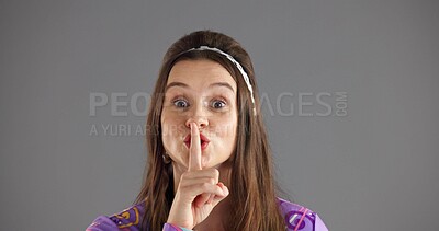 Buy stock photo Quiet, secret and portrait of woman in studio for gossip, silence and privacy on gray background. Emoji, gesture and face of person with finger for confidential news and shh, whisper and mystery