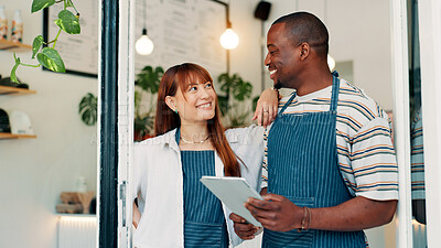 Buy stock photo Cafe, woman and man at door with tablet, smile and collaboration with small business team. Partner, confidence and happy restaurant staff at entrance on digital app for online booking, orders or list