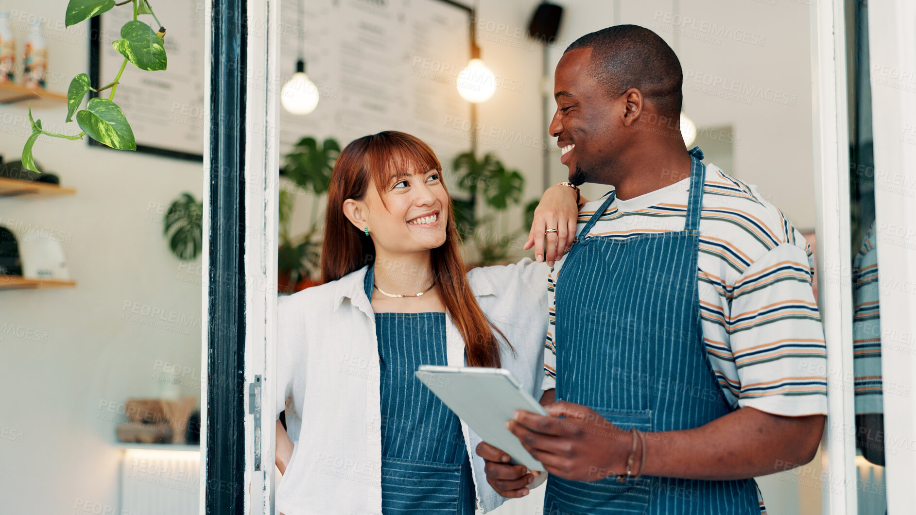 Buy stock photo Cafe, woman and man at door with tablet, smile and collaboration with small business team. Partner, confidence and happy restaurant staff at entrance on digital app for online booking, orders or list