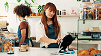 Waitress, woman and cash register in cafe for POS, track inventory or process payment at counter. Small business, cashier and electronic system for customer service, record transaction or hospitality