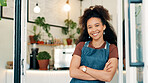 Portrait, smile and woman in cafe, arms crossed and hospitality industry with welcome. Person, business owner or entrepreneur with confidence, friendly service or entrance for coffee shop and apron
