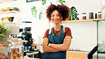 Woman, crossed arms and portrait of barista in cafe with confidence for hospitality career. Happy, startup and female waitress with pride for customer service at counter in restaurant or coffee shop.