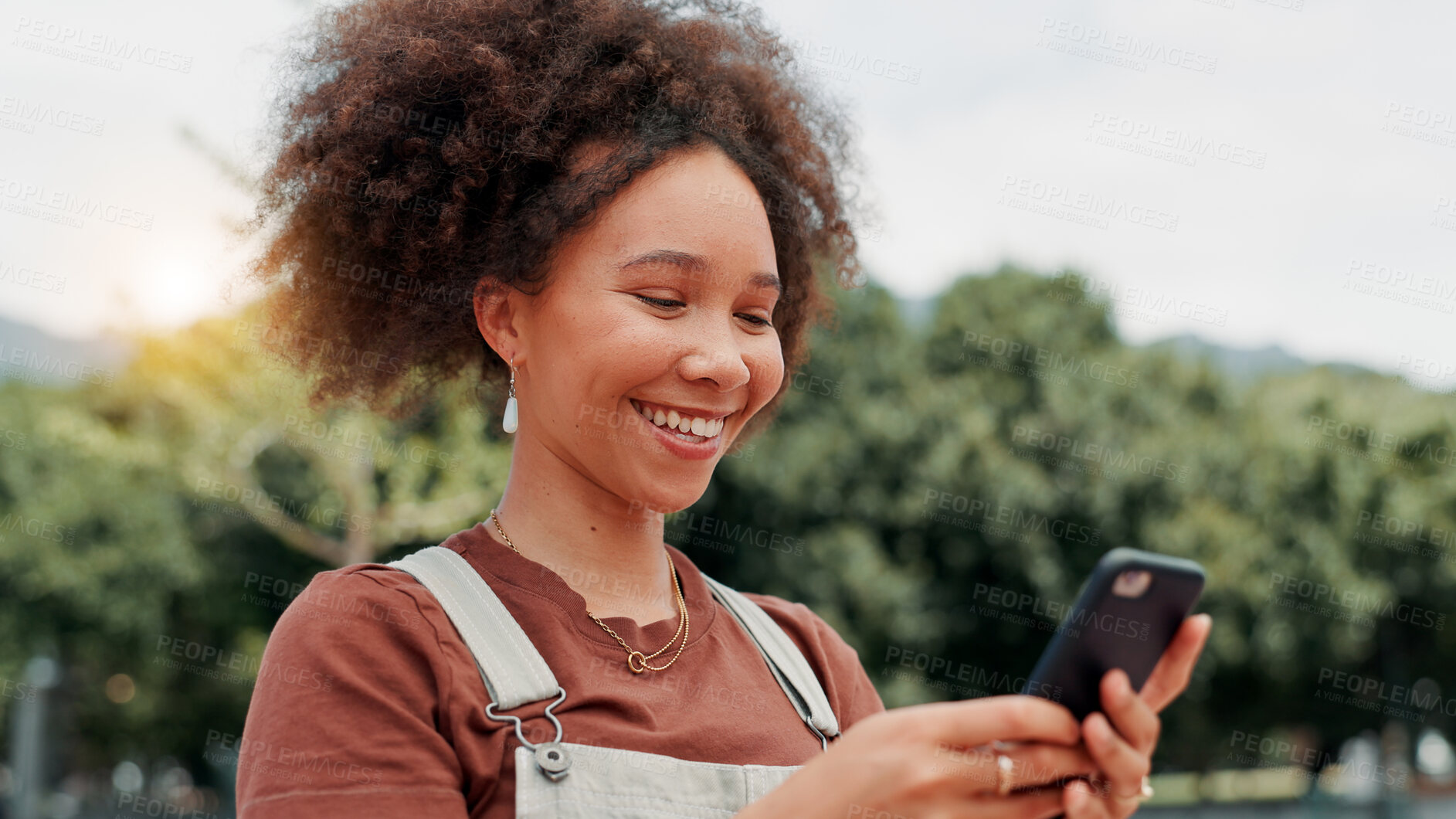 Buy stock photo Park, woman and smile with smartphone for social media, online communication and comment for reel. Outdoor, female person and laughing with mobile for application, funny joke and chat with contact