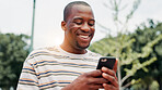 Park, black man and hands with smartphone for social media, online communication and comment for reel. Outdoor, male person and laughing with mobile for application, funny joke and chat with contact