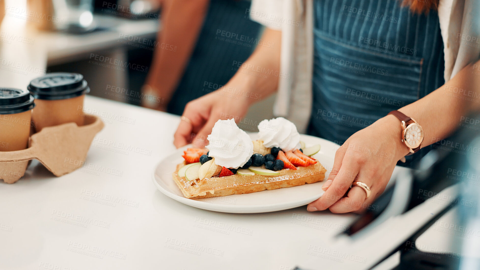Buy stock photo Hands, serving and waitress with breakfast in cafe for order, help or customer service at counter. Food, nutrition and closeup of barista with waffles, fruit and cream for morning meal in coffee shop