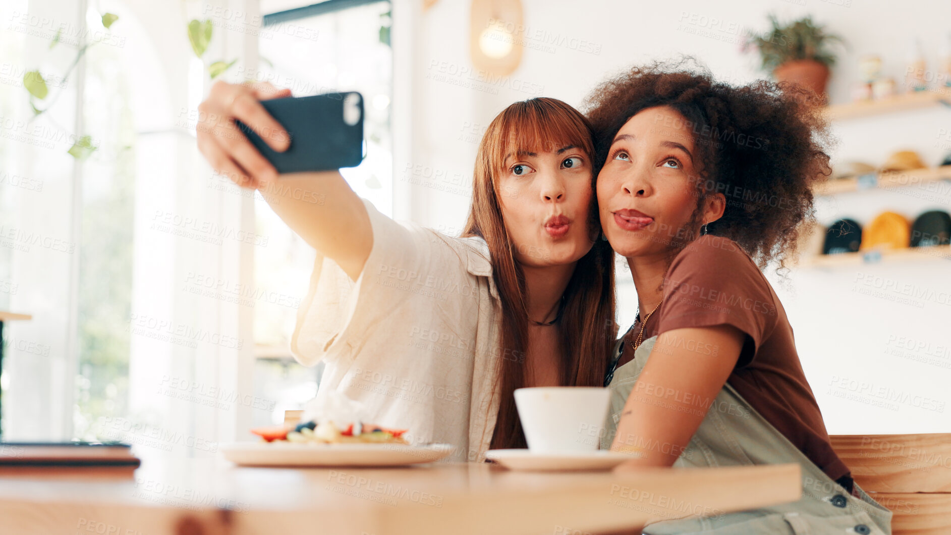 Buy stock photo Selfie, tongue out and women in coffee shop, silly and photography for memory of reunion or embrace. Goofy, friends and bonding on break with profile picture, happy or social media on weekend in cafe