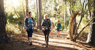 Buy stock photo Mature, women or friends on trail for hiking, outdoor adventure or journey in nature together. Talking, exercise and people in woods for holiday retirement, walking or trekking to explore terrain