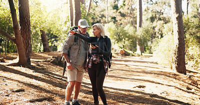 Buy stock photo Directions, hiking and phone with old couple in forest together to search for route to destination. App, lost and pointing with senior people outdoor in nature for health, exercise or fitness