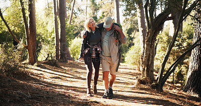 Buy stock photo Mature, couple and hiking with help for injury, fatigue or accident with support for walking. Travel, adventure and man assisting woman for trekking mistake, care or aid with sprain outdoor in forest