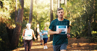 Buy stock photo Action, marathon and running with man in forest for challenge, performance or race. Competition, cardio and fitness with mature runner at rally event in nature or woods for course, heat or trial