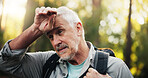 Senior, man and tired with sweating for hiking in forest, fatigue or burnout with difficult travel in nature. Backpacking, adventure or trekking with hard work, exhausted male hiker or warm weather