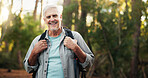 Portrait, hiking and senior man in forest for travel, holiday or vacation on adventure. Smile, trekking or old person in woods for backpacking, tourism and explore nature in retirement in Switzerland