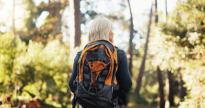 Buy stock photo Nature, backpacking and senior woman hiking with travel, adventure or journey on vacation. Outdoor, fitness and elderly female person trekking in forest for discovery on holiday or weekend trip.