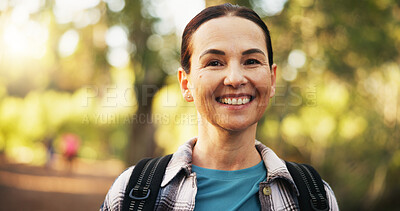 Buy stock photo Portrait, mature and happy woman hiking in forest for travel, holiday and vacation on adventure. Smile, trekking and person in woods for backpacking, tourism and explore nature in retirement in USA
