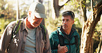 Fitness, hiking and man friends in forest together for exercise, health activity or hobby. Conversation, summer and wellness with hiker people outdoor in nature or woods for backpacking and trekking