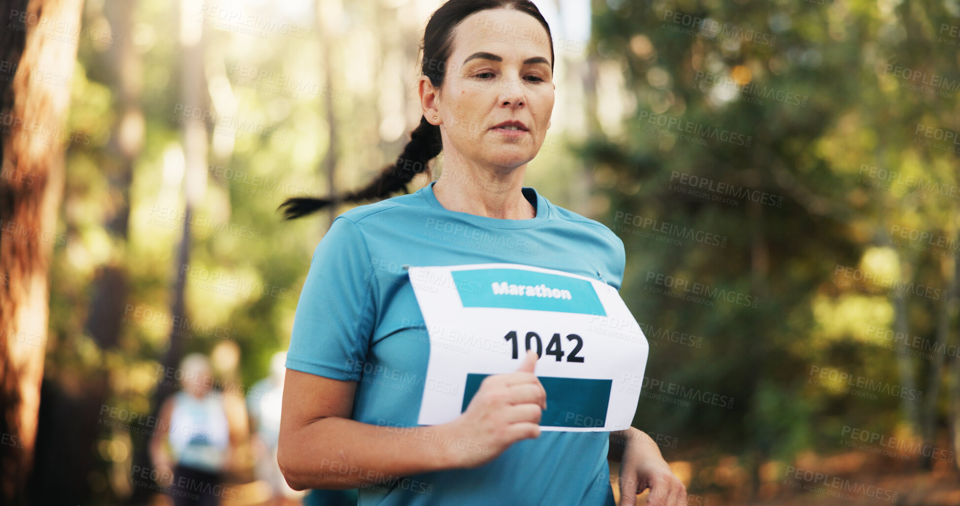 Buy stock photo Running, fitness and woman in forest, marathon and cardio with hobby, wellness and workout. Person, runner and athlete in woods, energy and practice with competition, race and sprint with endurance