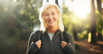 Buy stock photo Portrait, mature and happy woman in forest for hiking in adventure, nature or retirement. Smile, outdoor and senior female person on holiday for backpacking, trekking or exploration of environment
