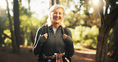 Buy stock photo Portrait, senior and happy woman hiking in woods for holiday, travel or vacation on adventure. Smile, trekking and  female person in forest for backpacking, tourism or explore nature for hobby in USA