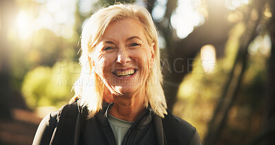 Buy stock photo Smile, senior woman and hiking in woods for holiday, travel and vacation on adventure with portrait. Face, trekking and person in forest for backpacking, tourism and explore outdoor for hobby in USA