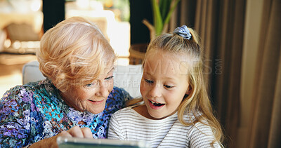 Buy stock photo Bonding, family or tablet with grandmother and grandchild on sofa in living room of retirement home for visit. App, relax or smile with girl and old woman in apartment for weekend conversation