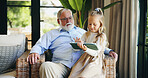 Relax, grandfather and child with tablet on sofa for playing online game, watching cartoon and weekend visit. Love, old man and girl with digital app in home for streaming service or bonding together
