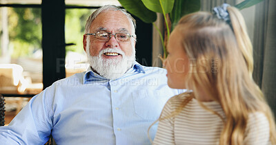 Buy stock photo Bonding, child and grandpa with smile, home and talking to granddaughter in living room or family. Happy, elderly man and conversation with girl in lounge, together or senior person with kid in house