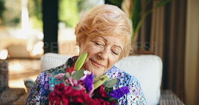 Buy stock photo Flowers, smile and relax with old woman on sofa for retirement, mothers day gift and celebration. Present, floral bouquet and happiness with senior person in living room of home for pride and plant