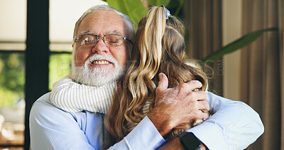 Buy stock photo Hug, grandchild and grandpa with smile, home and love for granddaughter in living room, family and care. Happy, elderly man and bonding with girl in lounge, embrace and excited for visit in house