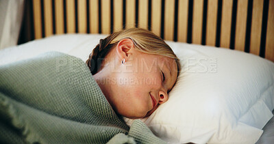 Buy stock photo Dreaming, rest and sleeping with girl in bed to relax for holiday, morning or vacation break. Children, peaceful and weekend with kid asleep in bedroom of home for comfort, development or wellness