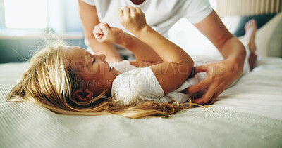 Buy stock photo Home, hands and child with tickle for playing, laughing and bonding together with happy smile. Bedroom, parent and girl with funny game for connection, childhood activity and support for relaxing