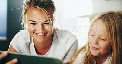 Buy stock photo Happy mother, child and watching with tablet on bed for online entertainment, show or cartoon at home. Mom, kid or daughter lying with smile on technology for subscription, app or streaming at house