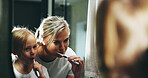 Mother, child and brushing teeth with mirror in bathroom for morning routine or cleaning mouth at home. Mom, daughter or kid with toothbrush for fresh breath, dental hygiene or oral care at house
