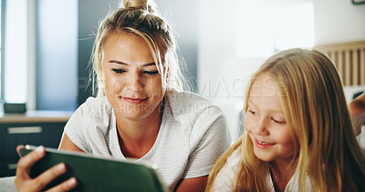 Buy stock photo Happy mom, child and watching with tablet on bed for online entertainment, show or cartoon at home. Mother, kid or daughter lying with smile on technology for subscription, app or streaming at house