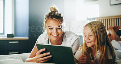 Buy stock photo Happy mother, daughter or watching with tablet on bed for online entertainment, show or cartoon at home. Mom, child or kid lying with smile on technology for subscription, app or streaming at house