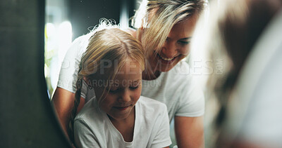 Buy stock photo Housework, love and smile of mother with daughter in home for daily routine or responsibility. Cleaning, laundry or washing machine with single parent woman and girl child in apartment for chores