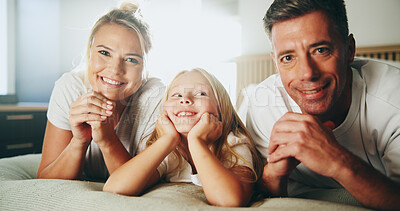 Buy stock photo Portrait, parents and relax with child in bedroom for love, security and bonding together on bed. Smile, people and rest with girl for support, care and family relationship for weekend break at house