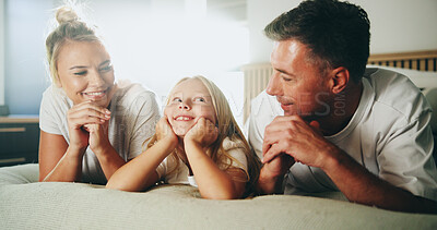 Buy stock photo Happy, parents and relax with child in bedroom for love, security and bonding together on bed. Smile, people and resting with girl for support, care and family relationship for weekend break at house