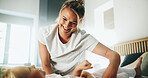 Home, mom and child with tickle for playing, laughing and bonding together with happy smile. Bedroom, mother and girl with funny game for connection, childhood activity and support for trust or relax