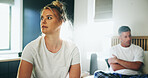 Frustrated couple, conflict and fight in bedroom for divorce, breakup or argument at home. Upset, woman and man with ignore or affair for toxic relationship, dispute or disagreement on bed at house