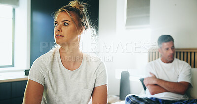 Buy stock photo Frustrated couple, conflict and fight in bedroom for divorce, breakup or argument at home. Upset, woman and man with ignore or affair for toxic relationship, dispute or disagreement on bed at house