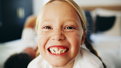 Buy stock photo Happy girl, portrait and child on bed for weekend, morning or oral care in joy at home. Face, teeth or kid with smile in relax for dental hygiene, comfort or positive attitude in bedroom at house