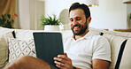 Home, smile and man on couch, tablet and internet with online video for humor, joke and social media. Apartment, tech and happy person on sofa, meme and laughing with digital app for entertainment
