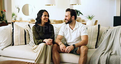 Buy stock photo Couple, happy and relax on sofa in home with security, support and relationship connection. Love, people and smile in living room with conversation, marriage commitment and bonding together with care