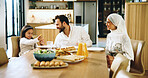 Smile, muslim family and food at house for Eid lunch, healthy meal and feast of celebration. Happy, parents and child play with nutrition snack, religious event and fasting cuisine of Islamic culture