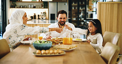 Buy stock photo Muslim, parents and kid with food at house for Eid lunch, healthy meal and feast for celebration. Mother, serving and family dish for nutrition, religious event and cuisine with love of Islam culture