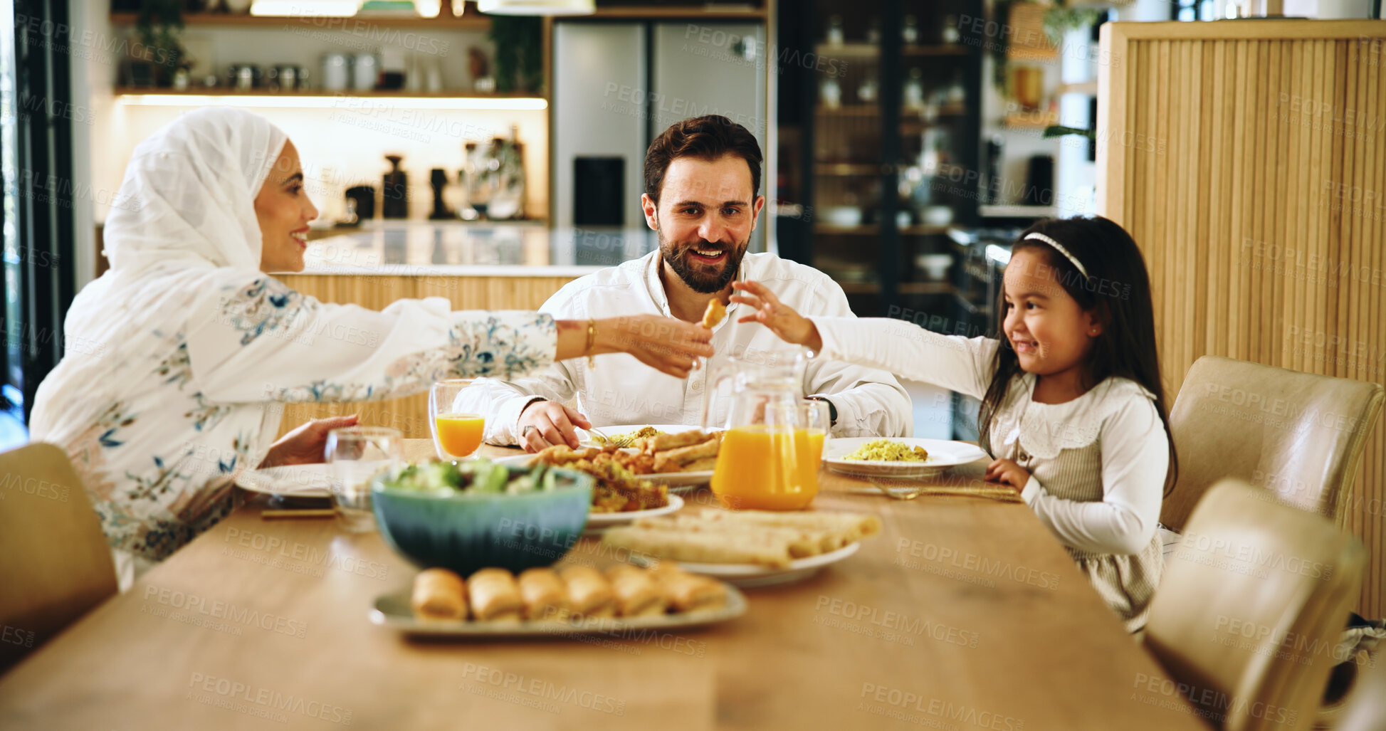 Buy stock photo Muslim, parents and kid with food at house for Eid lunch, healthy meal and feast for celebration. Mother, serving and family dish for nutrition, religious event and cuisine with love of Islam culture